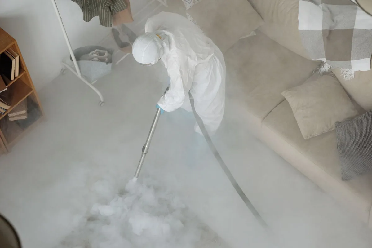 Biohazard cleanup technician in protective equipment, East Newark, NJ
